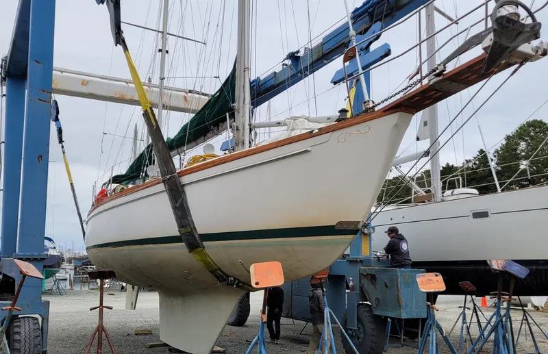 Isabella II Yacht Photos Pics 1988 Shannon 43 sailboat in dry dock, supported by stands and a crane.