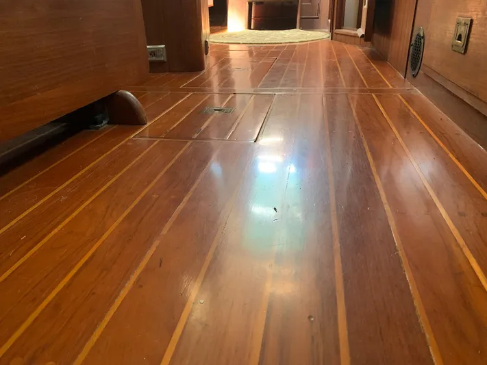 Isabella II Yacht Photos Pics Polished wooden floor inside a 1988 Shannon 43 boat interior.