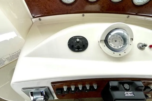 "sunseeker" Yacht Photos Pics Control panel of a 2002 Silverton 43 Motor Yacht with gauges and switches.