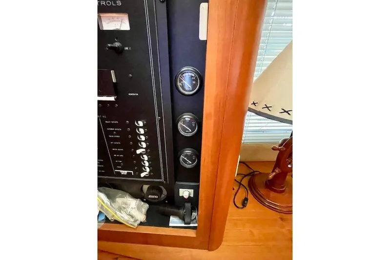 "sunseeker" Yacht Photos Pics 2002 Silverton 43 Motor Yacht control panel with gauges and wooden interior.