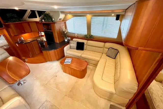 "sunseeker" Yacht Photos Pics Luxurious interior of 2002 Silverton 43 Motor Yacht with plush seating and modern kitchen.