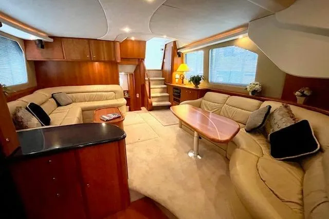 "sunseeker" Yacht Photos Pics Luxurious interior of a 2002 Silverton 43 Motor Yacht with plush seating and elegant decor.