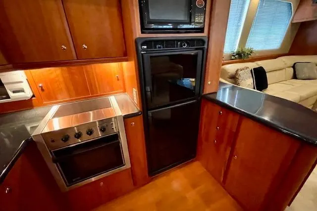 "sunseeker" Yacht Photos Pics Luxurious kitchen interior of 2002 Silverton 43 Motor Yacht with modern appliances.