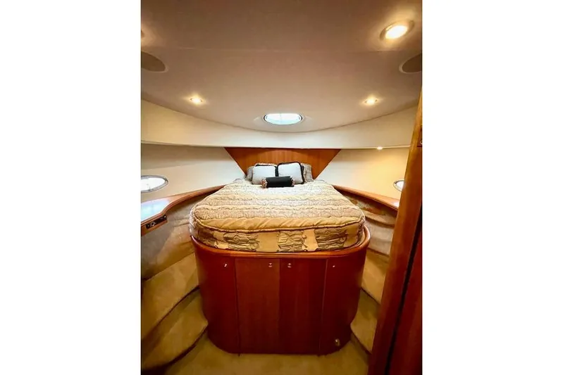 "sunseeker" Yacht Photos Pics Luxurious bedroom interior of 2002 Silverton 43 Motor Yacht with cozy bedding.