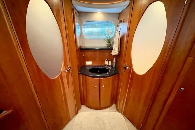 "sunseeker" Yacht Photos Pics Luxurious 2002 Silverton 43 Motor Yacht bathroom with wood finish and modern fixtures.