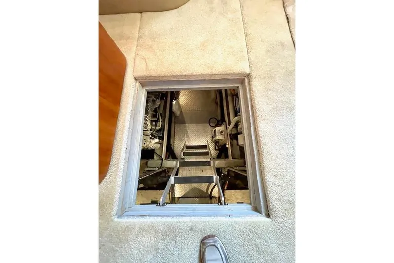 "sunseeker" Yacht Photos Pics Engine room access hatch on 2002 Silverton 43 Motor Yacht, showcasing interior mechanics.