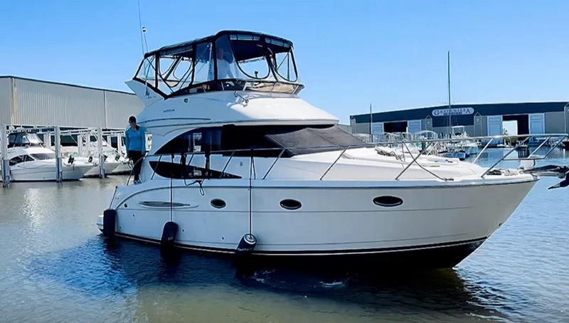 Compass Rose Yacht Photos Pics 2006 Meridian 341 Sedan yacht docked at marina, clear sky, calm water.