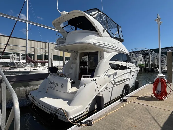 Compass Rose Yacht Photos Pics 2006 Meridian 341 Sedan yacht docked at marina under clear blue sky.
