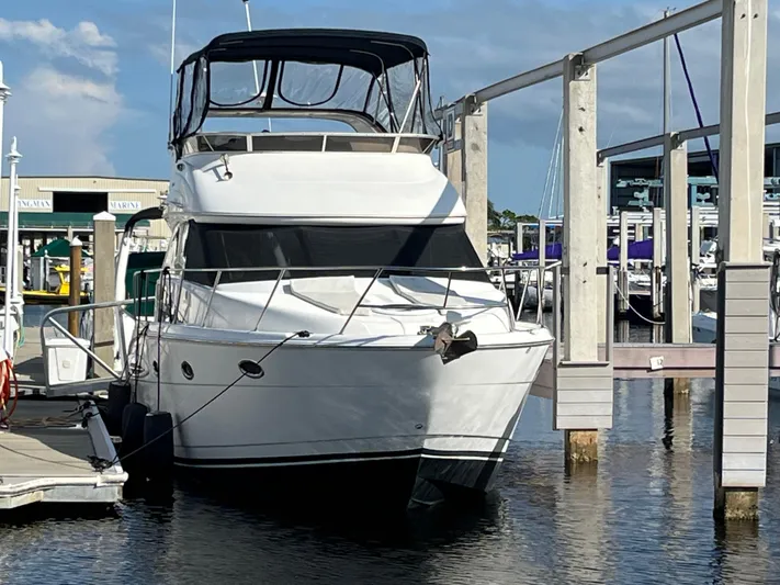 Compass Rose Yacht Photos Pics 2006 Meridian 341 Sedan yacht docked at marina under clear blue sky.