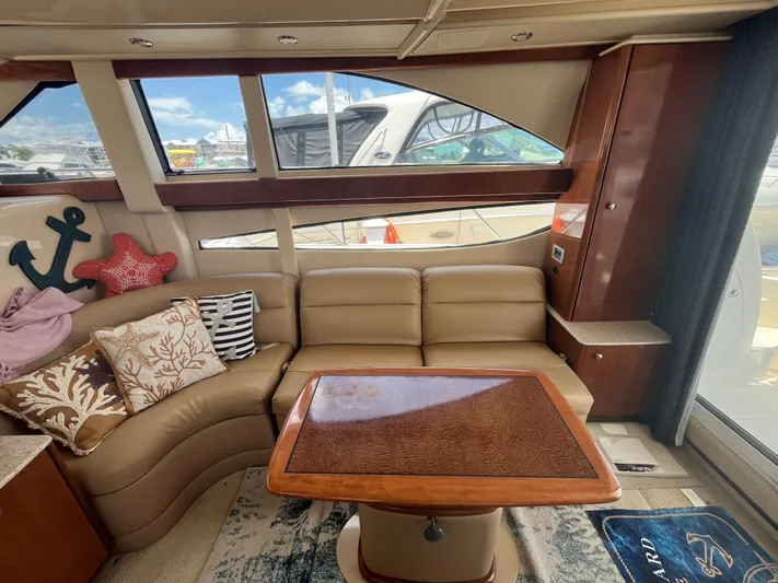 Compass Rose Yacht Photos Pics Luxurious interior of 2006 Meridian 341 Sedan with plush seating and nautical decor.