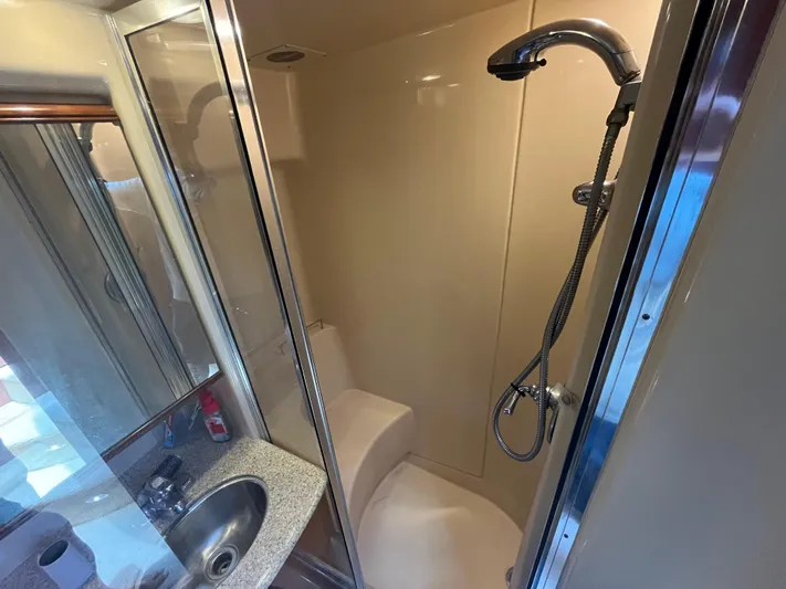 Compass Rose Yacht Photos Pics Shower area in 2006 Meridian 341 Sedan yacht with modern fixtures and compact design.
