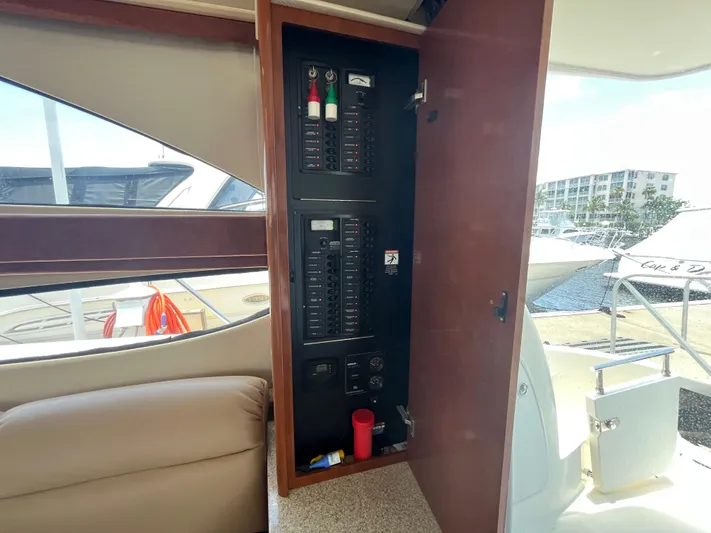 Compass Rose Yacht Photos Pics Electrical panel inside a 2006 Meridian 341 Sedan yacht, docked at a marina.