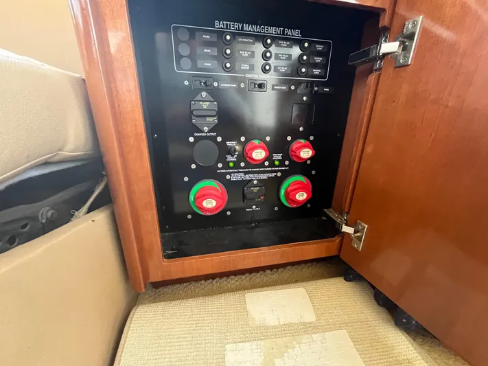 Compass Rose Yacht Photos Pics Battery management panel inside a 2006 Meridian 341 Sedan yacht, featuring control switches.
