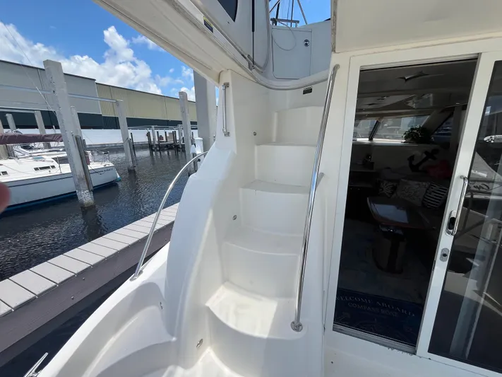 Compass Rose Yacht Photos Pics Staircase and interior view of 2006 Meridian 341 Sedan yacht at marina.