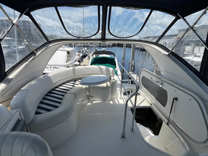 Compass Rose Yacht Photos Pics 2006 Meridian 341 Sedan yacht interior with seating and table, docked at marina.