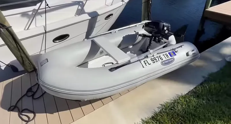 Compass Rose Yacht Photos Pics Inflatable boat docked beside a 2006 Meridian 341 Sedan yacht.