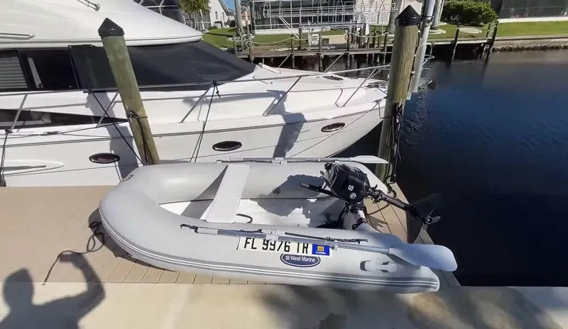 Compass Rose Yacht Photos Pics Inflatable boat docked beside a 2006 Meridian 341 Sedan yacht.