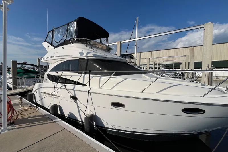 Compass Rose Yacht Photos Pics 2006 Meridian 341 Sedan yacht docked at marina under clear blue sky.
