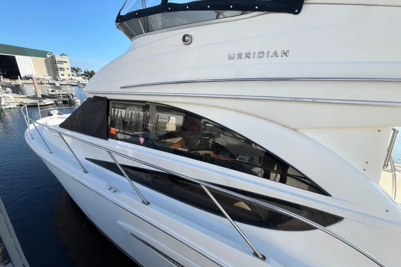 Compass Rose Yacht Photos Pics 2006 Meridian 341 Sedan yacht docked at marina, showcasing sleek design and spacious cabin.