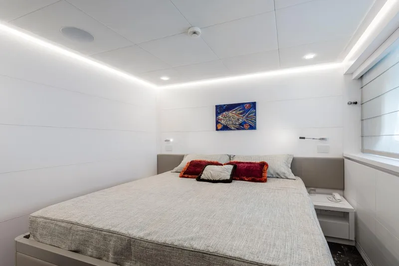 Sands Yacht Photos Pics Luxurious bedroom interior on 2018 Maiora 36 yacht, featuring modern design and elegant decor.