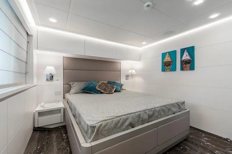 Sands Yacht Photos Pics Luxurious bedroom interior on 2018 Maiora 36 yacht, featuring modern design and elegant decor.