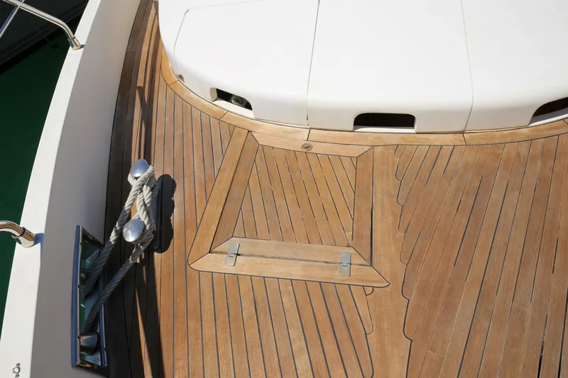  Yacht Photos Pics Teak deck of 2010 Azimut Fly 78 yacht with mooring cleat and rope.