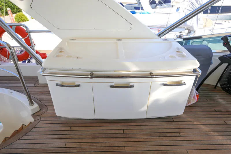  Yacht Photos Pics Outdoor kitchenette on 2010 Azimut Fly 78 yacht with wooden deck.