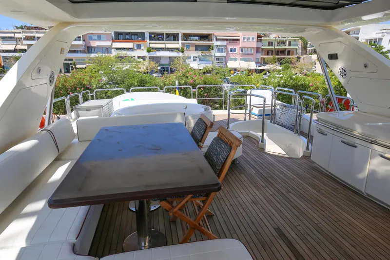  Yacht Photos Pics Luxurious 2010 Azimut Fly 78 yacht deck with seating and dining area.