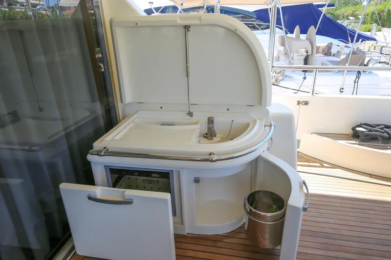  Yacht Photos Pics Outdoor kitchenette on 2010 Azimut Fly 78 yacht with sink and storage.