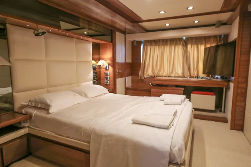 Yacht Photos Pics Luxurious bedroom interior on 2010 Azimut Fly 78 yacht with elegant decor and modern amenities.