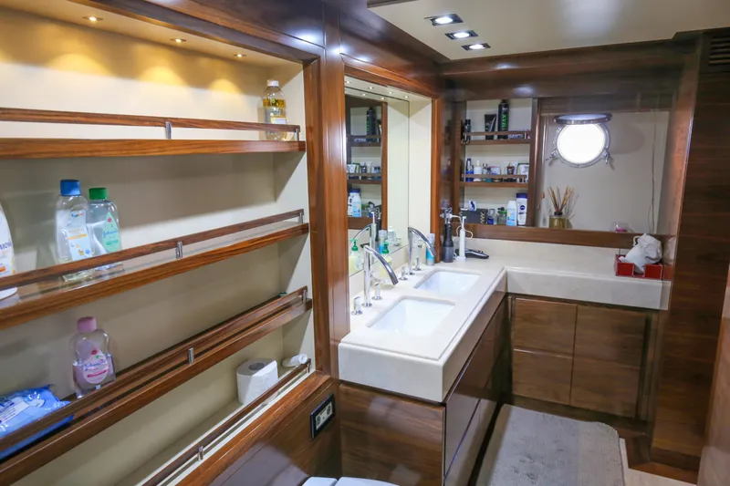  Yacht Photos Pics Luxurious bathroom interior of 2010 Azimut Fly 78 yacht with double sinks and wooden cabinetry.