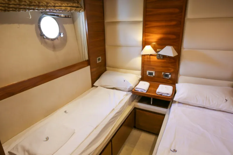  Yacht Photos Pics Luxurious twin cabin interior on 2010 Azimut Fly 78 yacht, featuring elegant wood paneling.