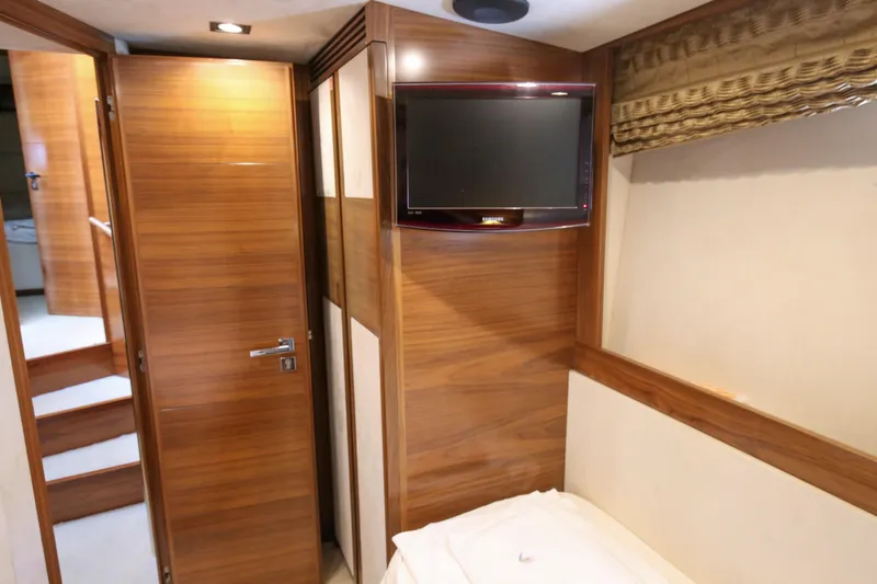  Yacht Photos Pics Interior of 2010 Azimut Fly 78 yacht with wood paneling and wall-mounted TV.