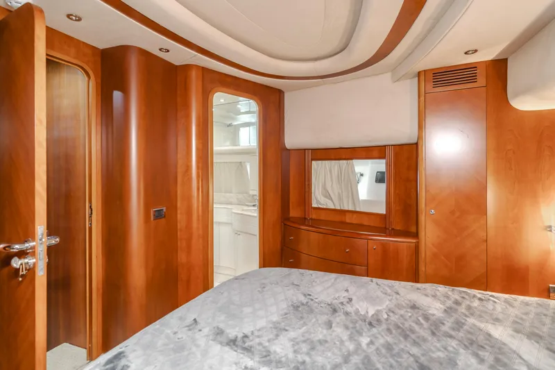 Anejo Yacht Photos Pics Luxurious wood-finished bedroom interior of 2005 Azimut 85 Ultimate yacht.