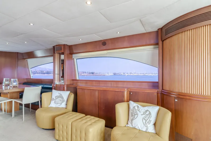 Anejo Yacht Photos Pics Luxurious interior of 2005 Azimut 85 Ultimate yacht with elegant seating and scenic window view.