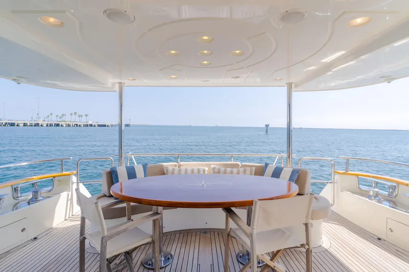 Anejo Yacht Photos Pics Luxury yacht Azimut 85 Ultimate 2005, elegant deck dining area with ocean view.