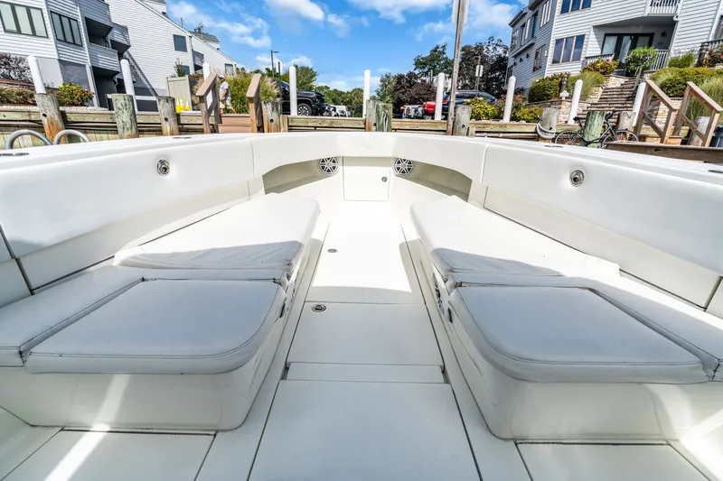  Yacht Photos Pics Interior view of a 2016 SeaVee 390Z boat with white seating.