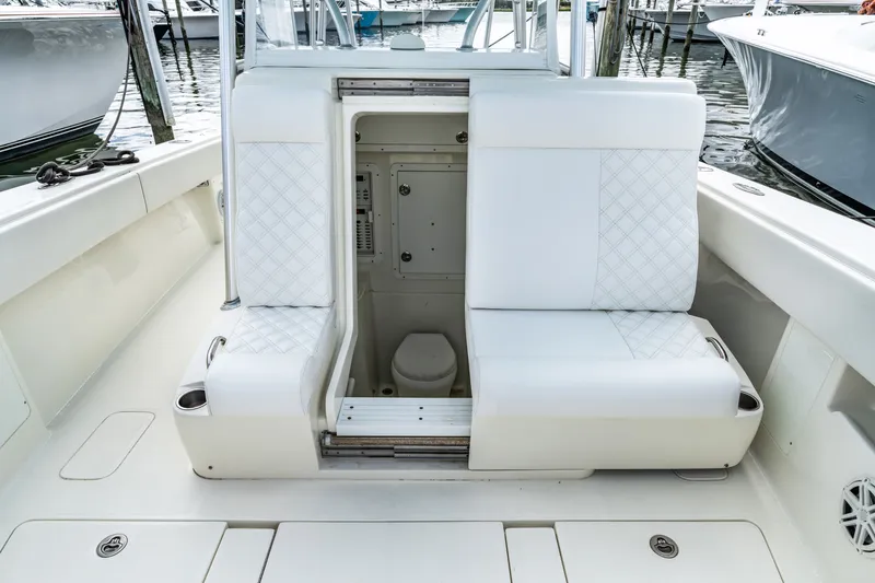  Yacht Photos Pics Interior of a 2016 SeaVee 390Z with seating and toilet.