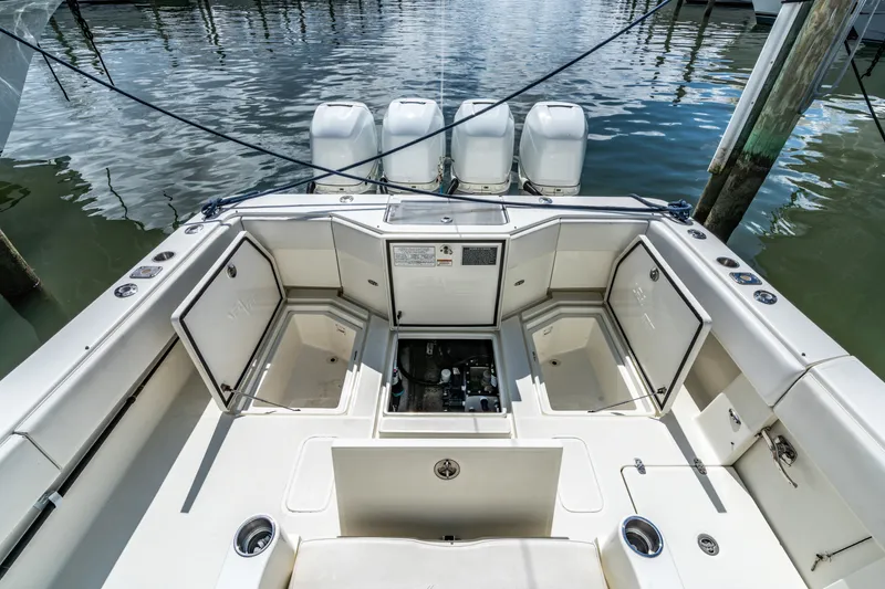  Yacht Photos Pics Interior view of a 2016 SeaVee 390Z boat with open storage compartments.