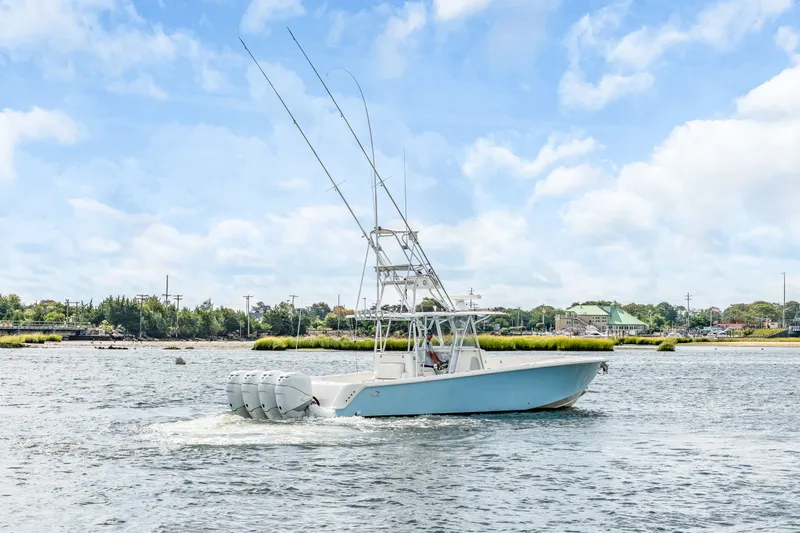  Yacht Photos Pics 2016 SeaVee 390Z boat on calm water with blue sky.