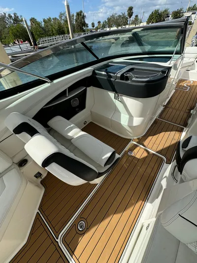  Yacht Photos Pics 2015 Sea Ray 350 SLX boat interior with sleek seating and wooden flooring.