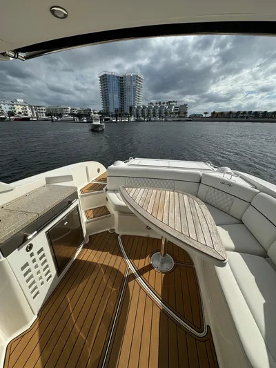  Yacht Photos Pics 2015 Sea Ray 350 SLX boat with elegant seating and waterfront cityscape view.