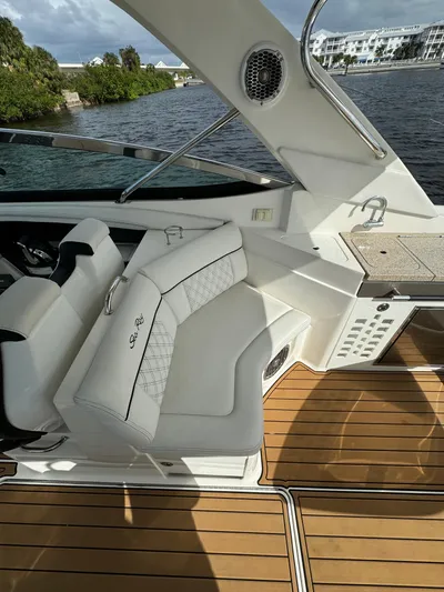  Yacht Photos Pics 2015 Sea Ray 350 SLX boat interior with white seating and wooden deck.