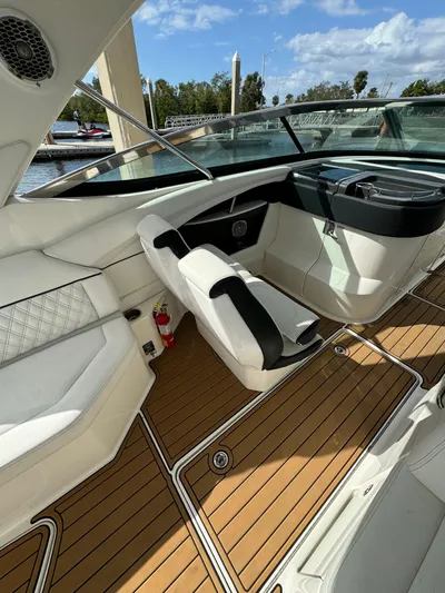  Yacht Photos Pics 2015 Sea Ray 350 SLX boat interior with luxurious seating and wood flooring.