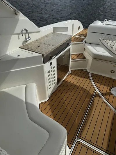  Yacht Photos Pics 2015 Sea Ray 350 SLX boat interior with teak flooring and kitchenette.