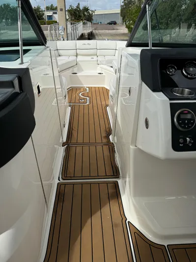  Yacht Photos Pics 2015 Sea Ray 350 SLX boat interior with teak flooring and modern dashboard.