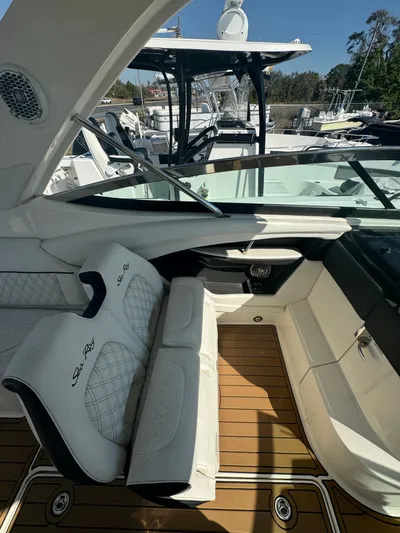  Yacht Photos Pics 2015 Sea Ray 350 SLX boat interior with white seating and teak flooring.
