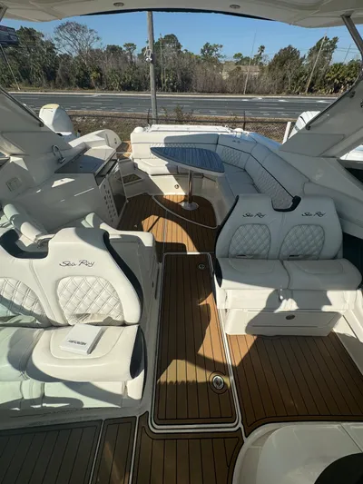  Yacht Photos Pics 2015 Sea Ray 350 SLX boat interior with white seating and wood flooring.