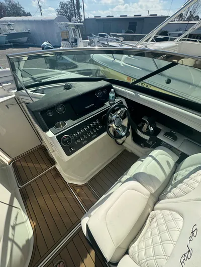  Yacht Photos Pics 2015 Sea Ray 350 SLX boat cockpit with luxurious seating and modern controls.