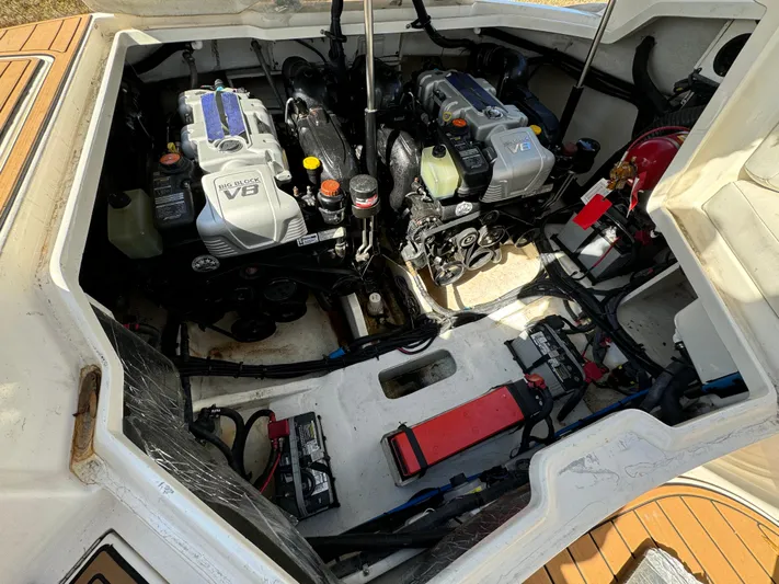  Yacht Photos Pics Engine compartment of a 2015 Sea Ray 350 SLX boat, showcasing dual engines and components.